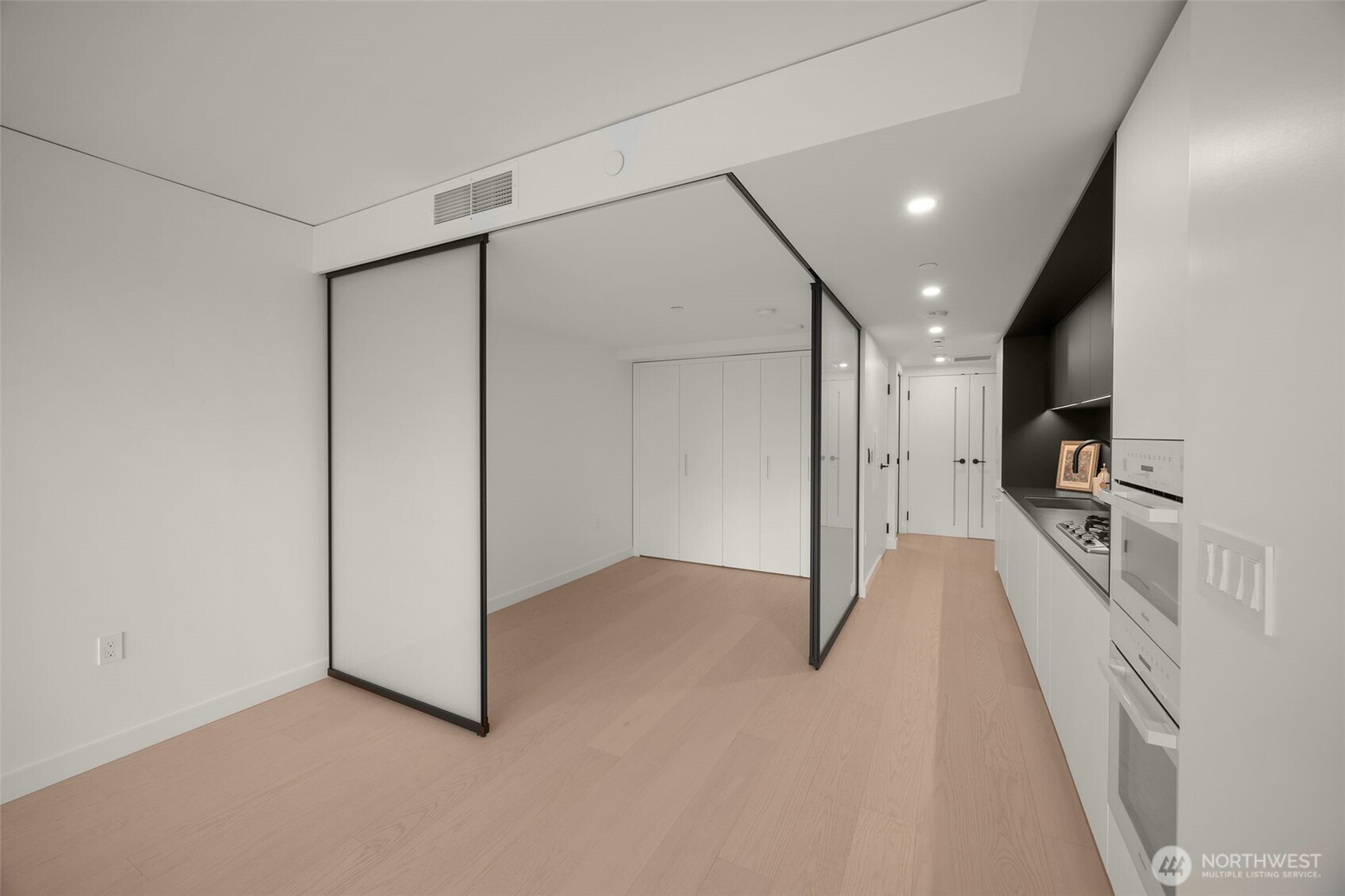 300 Virginia Street, Unit 3607 Seattle, WA 98101 - Photo 7 of 37 a view of a hallway with a couch