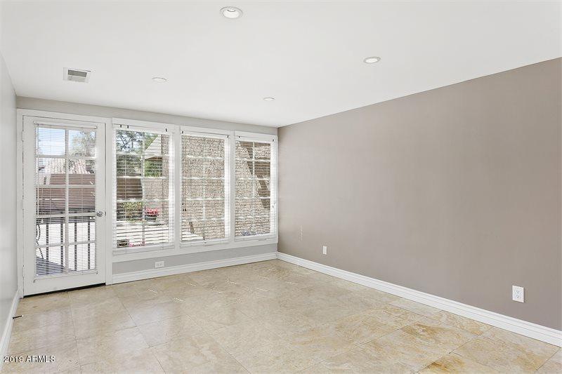 4438 East Camelback Road, Unit 143 Phoenix, AZ 85018 - Photo 10 of 30 an empty room with a window