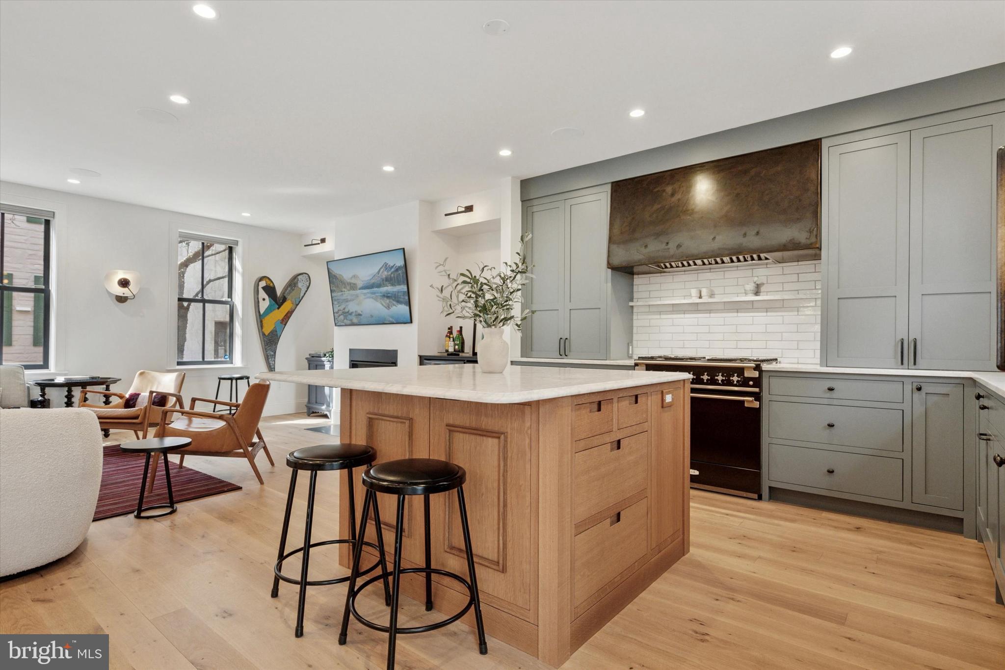 1725-27 Addison Street Philadelphia, PA 19146 - Photo 11 of 43 a kitchen with granite countertop a sink and chairs