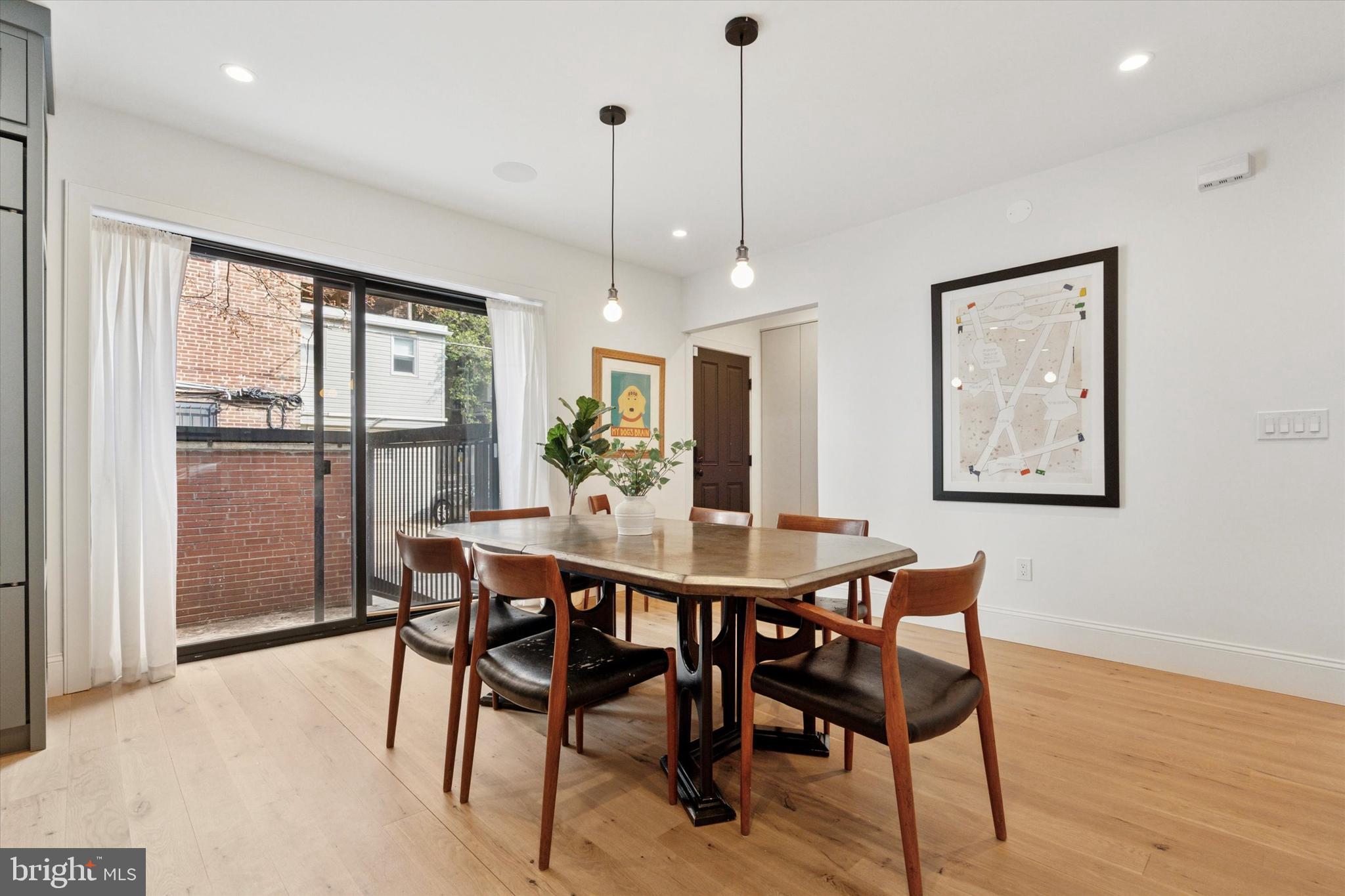 1725-27 Addison Street Philadelphia, PA 19146 - Photo 13 of 43 a view of a dining room with furniture window and wooden floor
