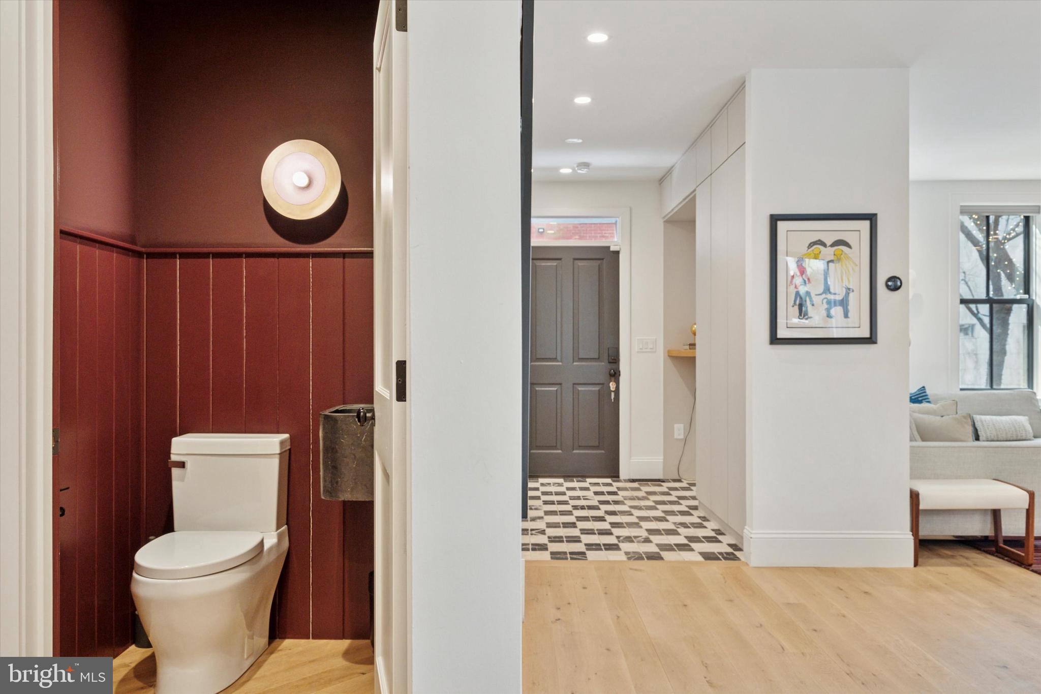1725-27 Addison Street Philadelphia, PA 19146 - Photo 14 of 43 a bathroom with a toilet a sink and a mirror