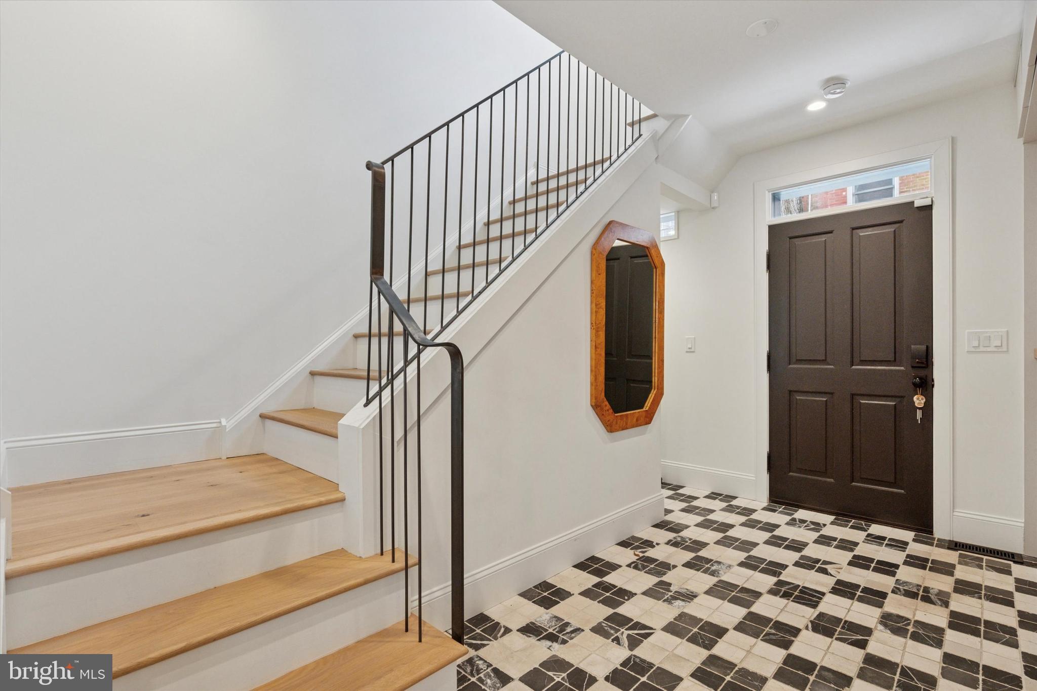 1725-27 Addison Street Philadelphia, PA 19146 - Photo 16 of 43 a bedroom with a bed and wooden floor