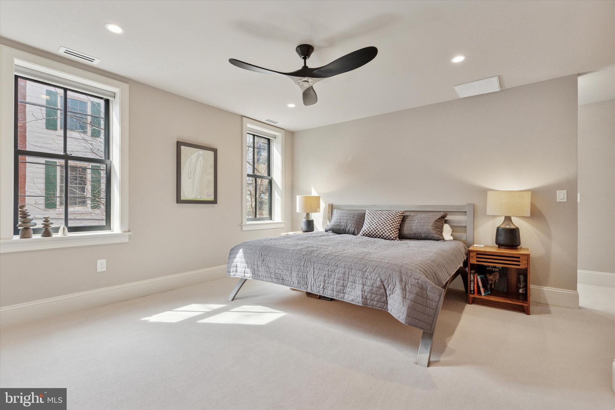 1725-27 Addison Street Philadelphia, PA 19146 - Photo 17 of 43 a spacious bedroom with a balcony a bed and a window