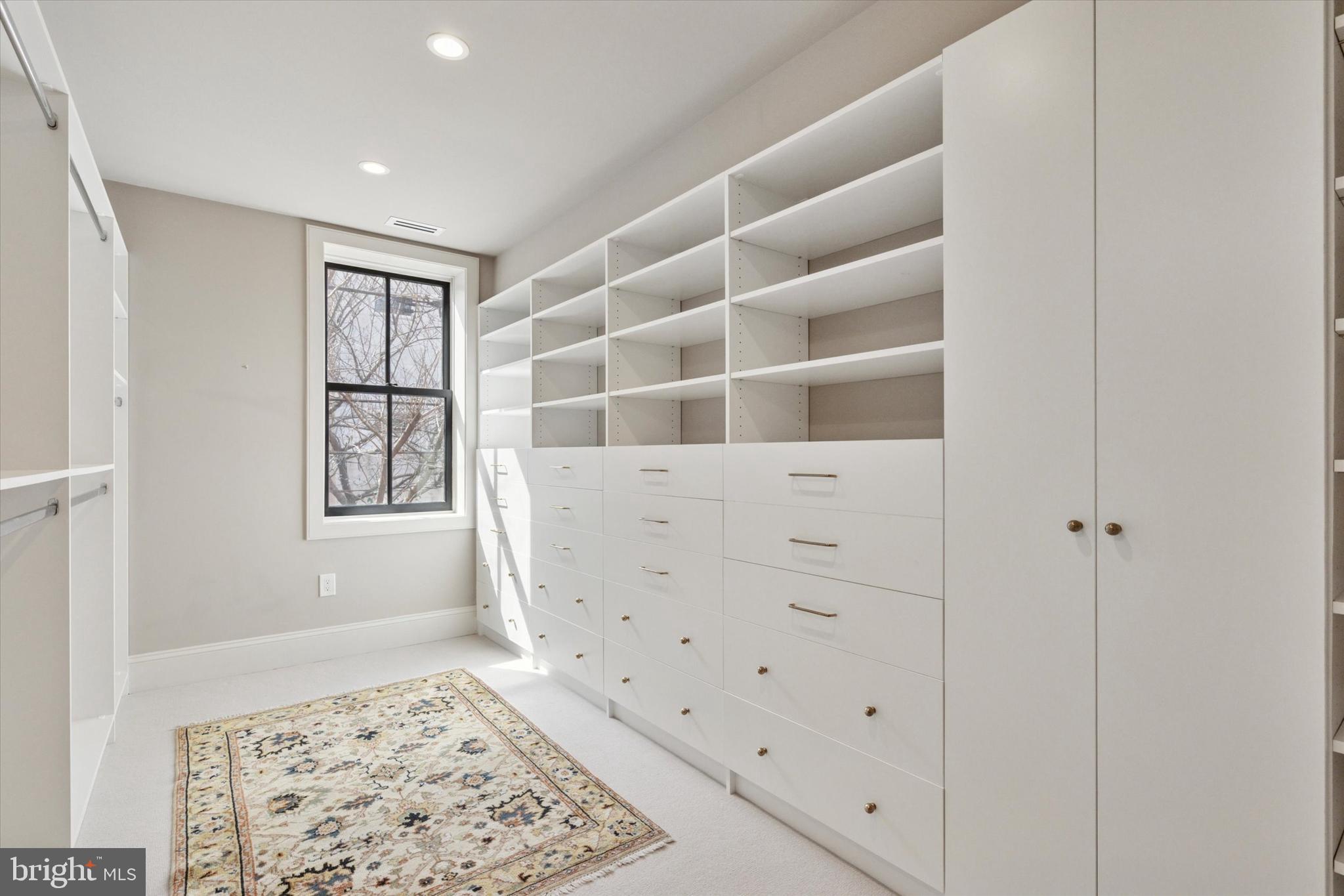 1725-27 Addison Street Philadelphia, PA 19146 - Photo 18 of 43 a view of an empty room with a window