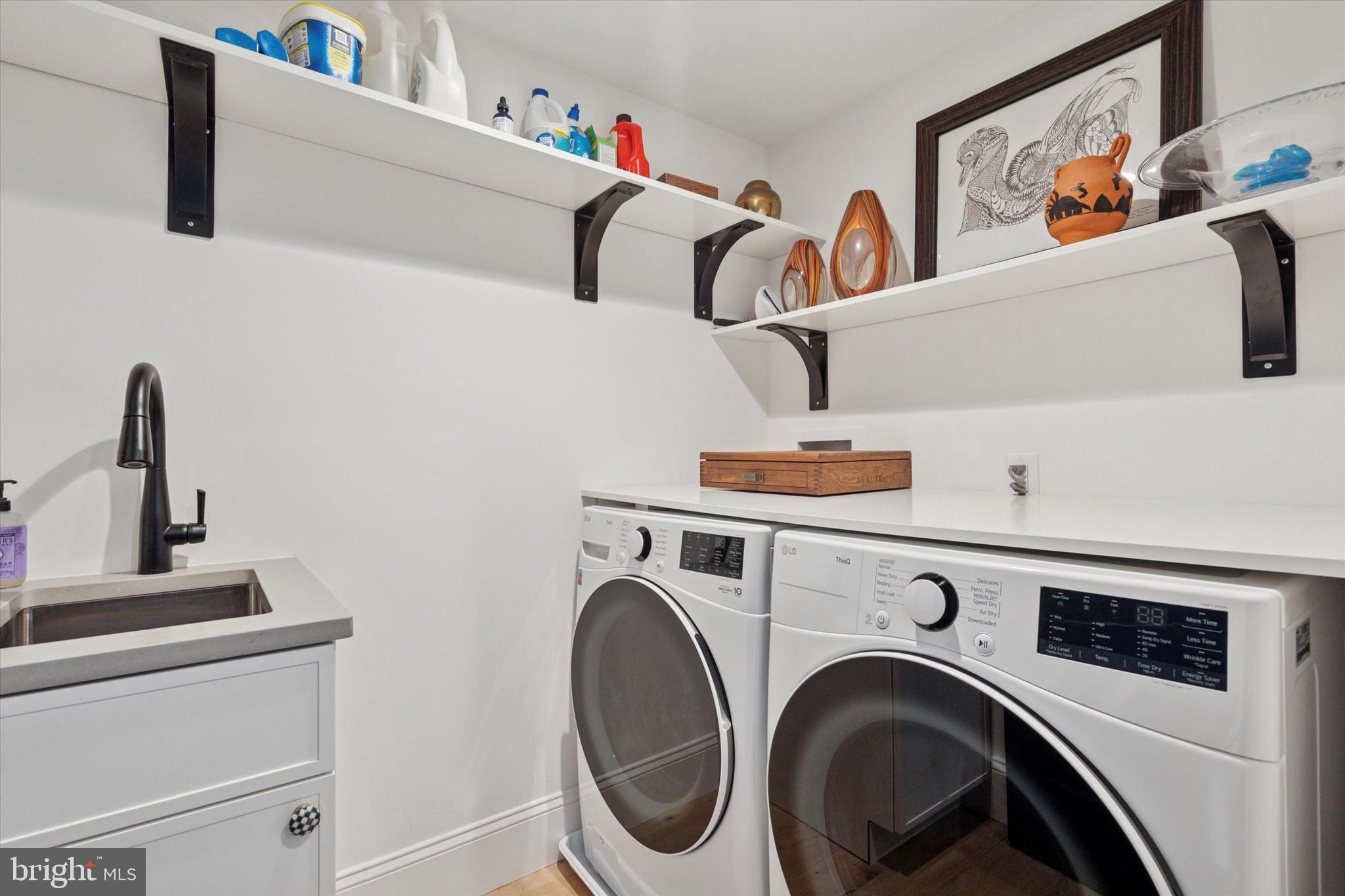 1725-27 Addison Street Philadelphia, PA 19146 - Photo 24 of 43 a utility room with dryer and washer
