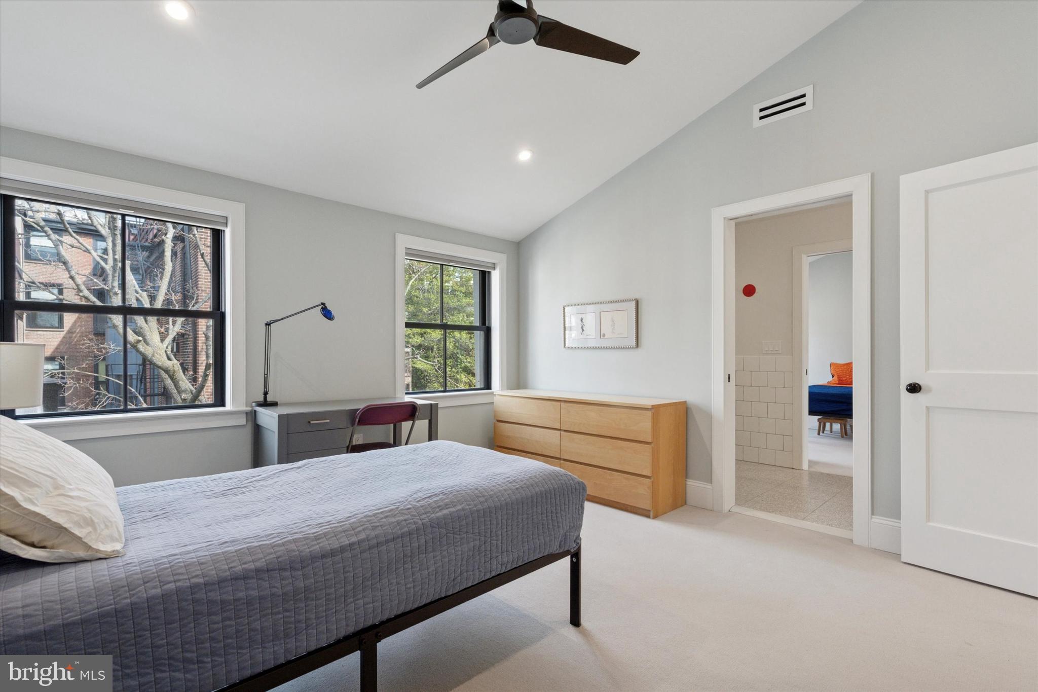 1725-27 Addison Street Philadelphia, PA 19146 - Photo 31 of 43 a bedroom with a large bed and a window