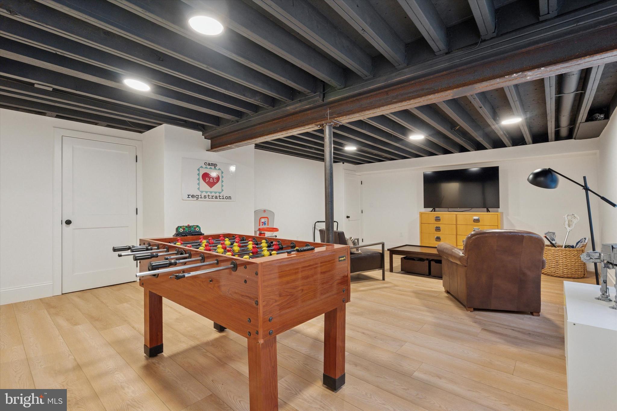 1725-27 Addison Street Philadelphia, PA 19146 - Photo 35 of 43 a work room with furniture and a projector screen