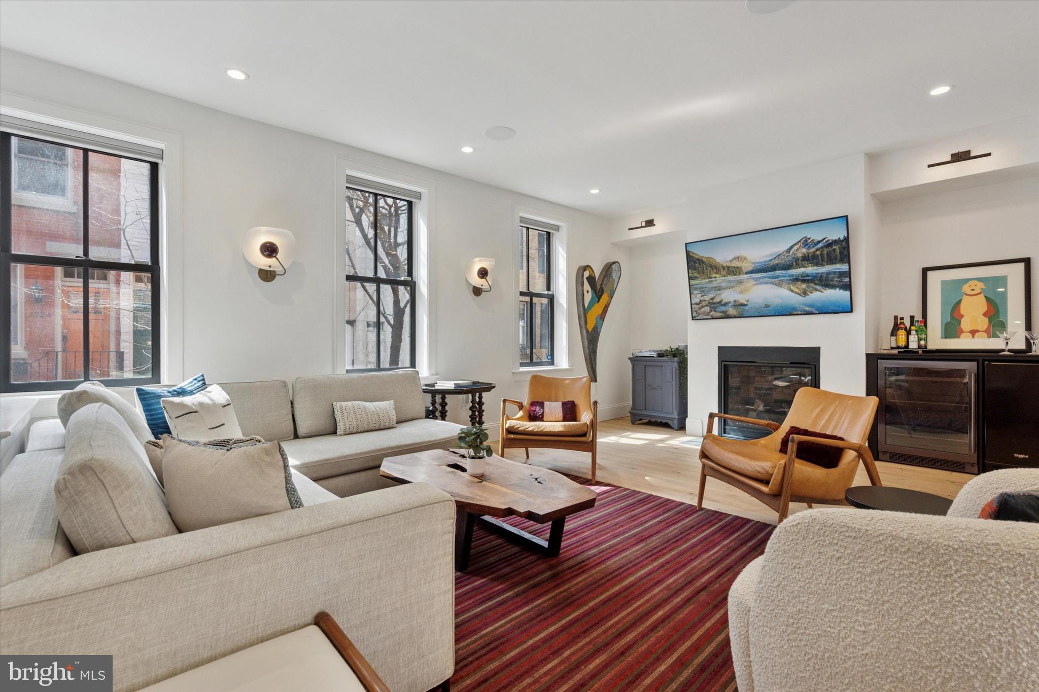 1725-27 Addison Street Philadelphia, PA 19146 - Photo 4 of 43 a living room with fireplace furniture and a fireplace