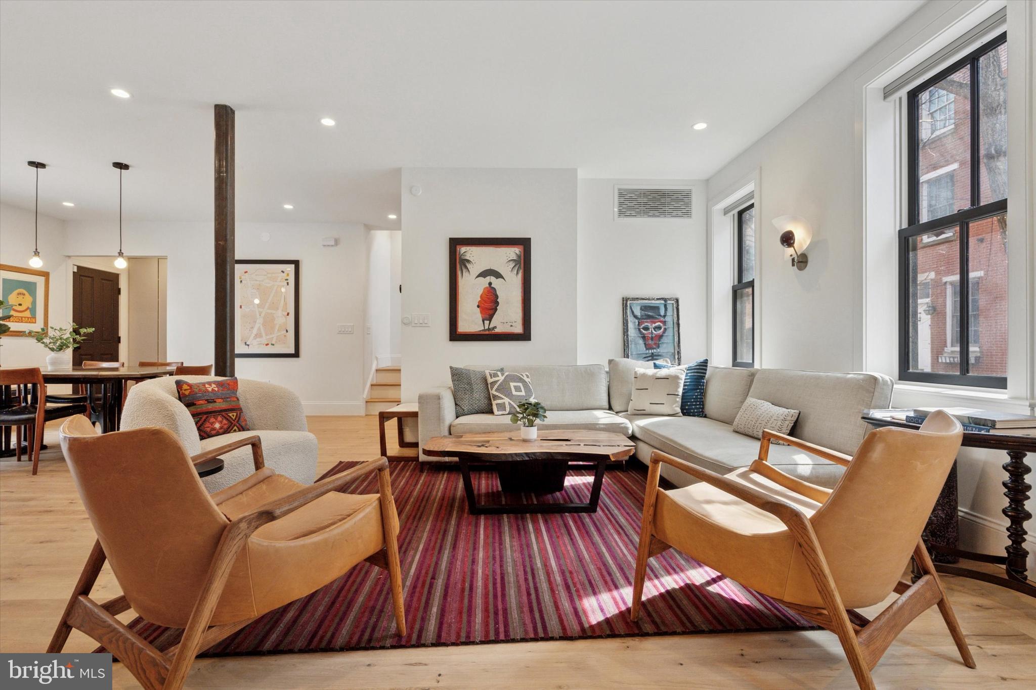 1725-27 Addison Street Philadelphia, PA 19146 - Photo 5 of 43 a living room with furniture and wooden floor
