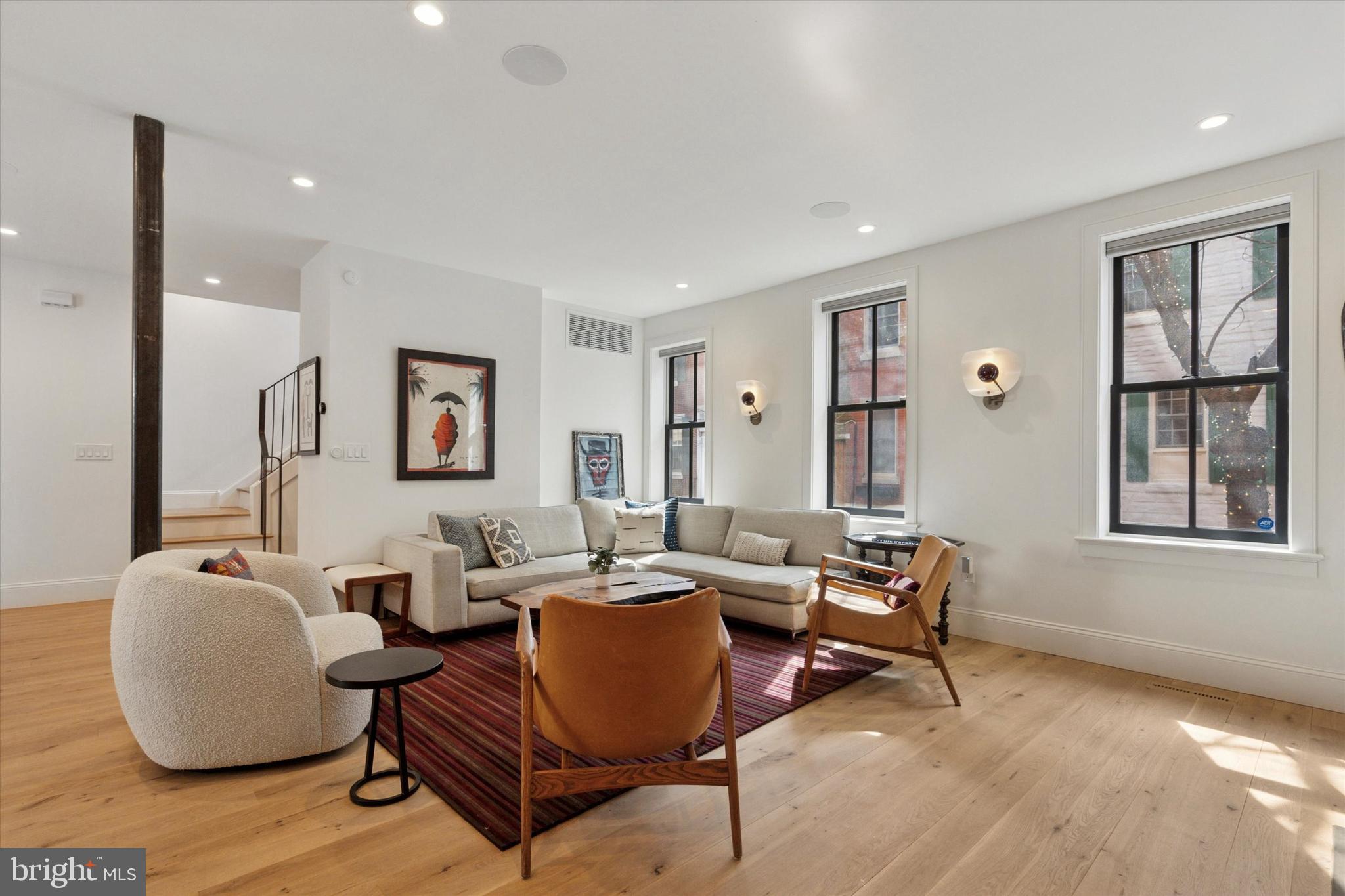 1725-27 Addison Street Philadelphia, PA 19146 - Photo 6 of 43 a living room with furniture and wooden floor