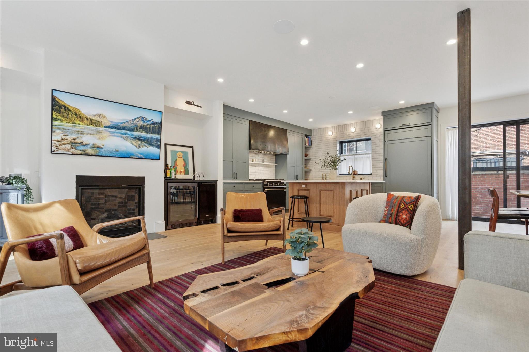 1725-27 Addison Street Philadelphia, PA 19146 - Photo 7 of 43 a living room with furniture and a fireplace