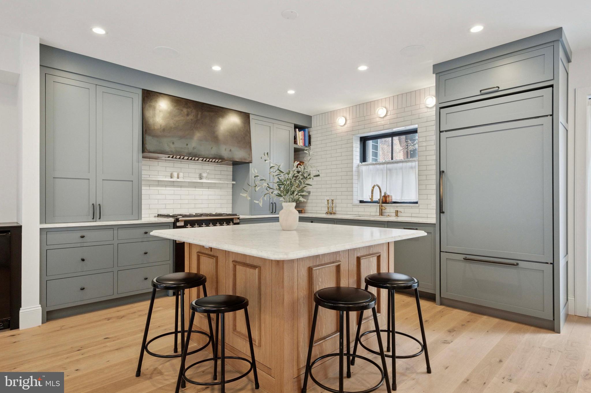 1725-27 Addison Street Philadelphia, PA 19146 - Photo 9 of 43 a kitchen with stainless steel appliances a refrigerator and a stove top oven