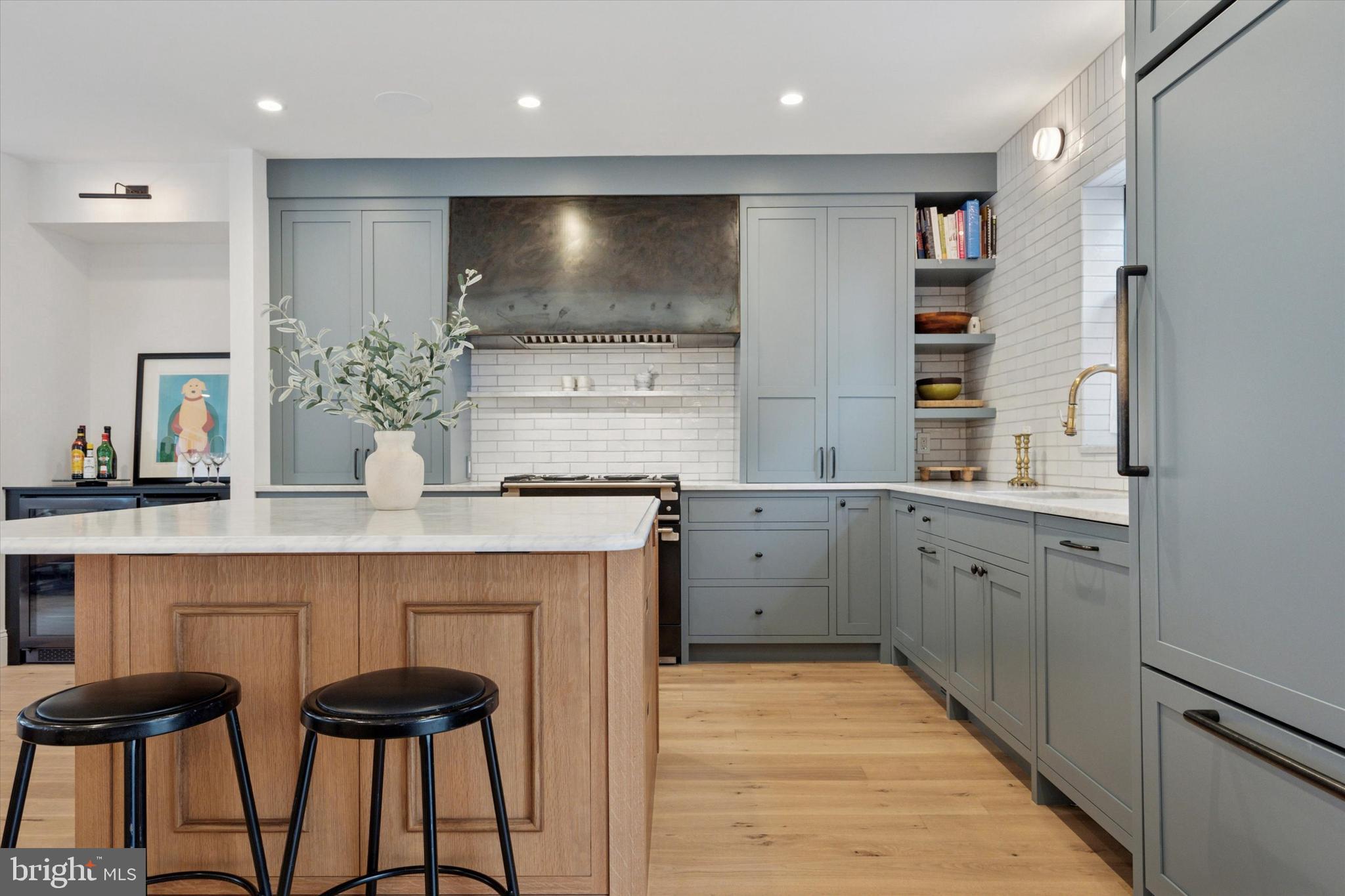 1725-27 Addison Street Philadelphia, PA 19146 - Photo 10 of 43 a kitchen with cabinets and chairs