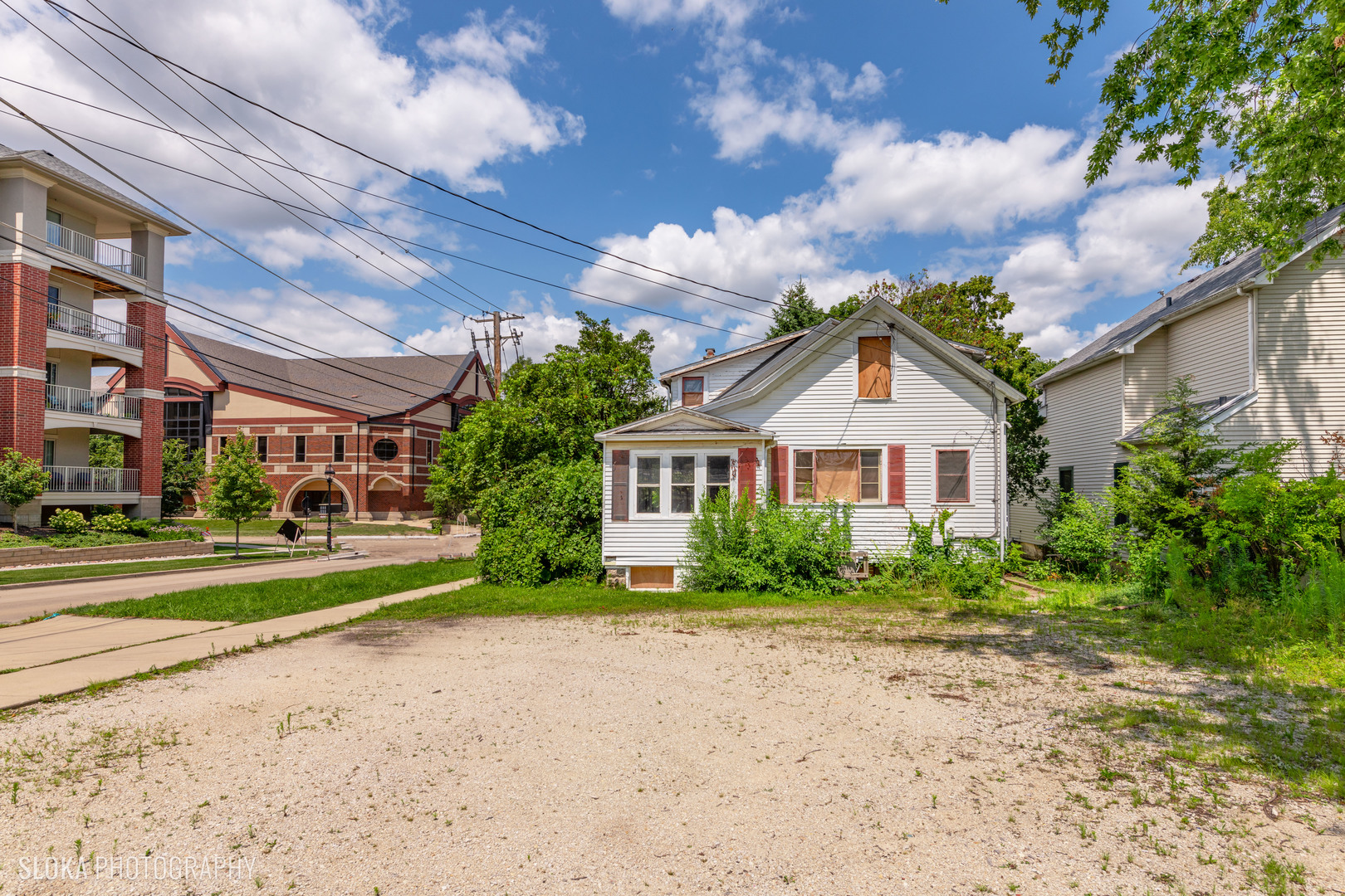 451 Duane Street Glen Ellyn, IL 60137 - Photo 2 of 17 a front view of a house with a garden