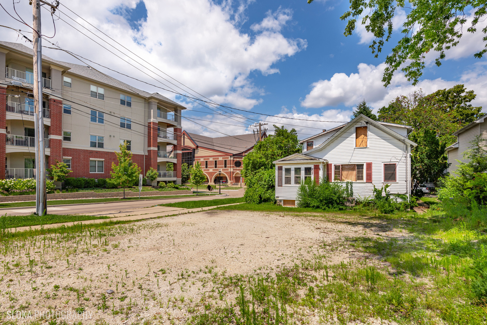 451 Duane Street Glen Ellyn, IL 60137 - Photo 3 of 17 a view of a big house with a big yard and large trees