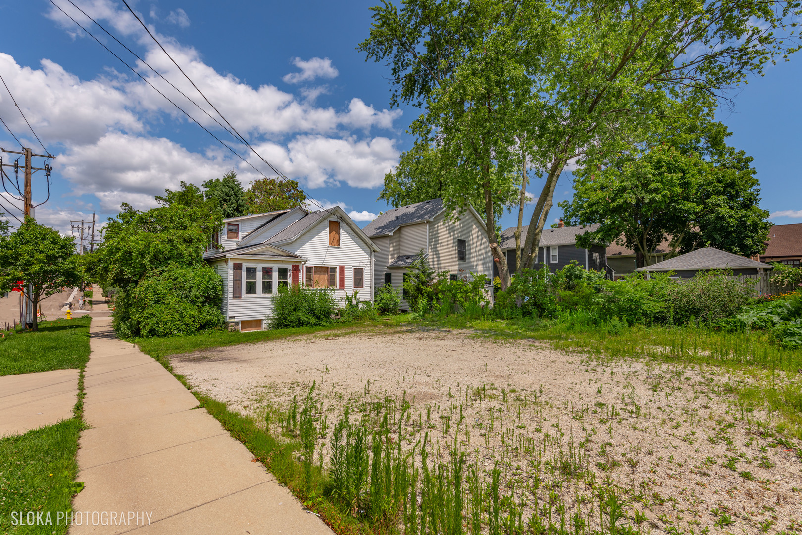451 Duane Street Glen Ellyn, IL 60137 - Photo 4 of 17 a front view of a house with a yard and a garage
