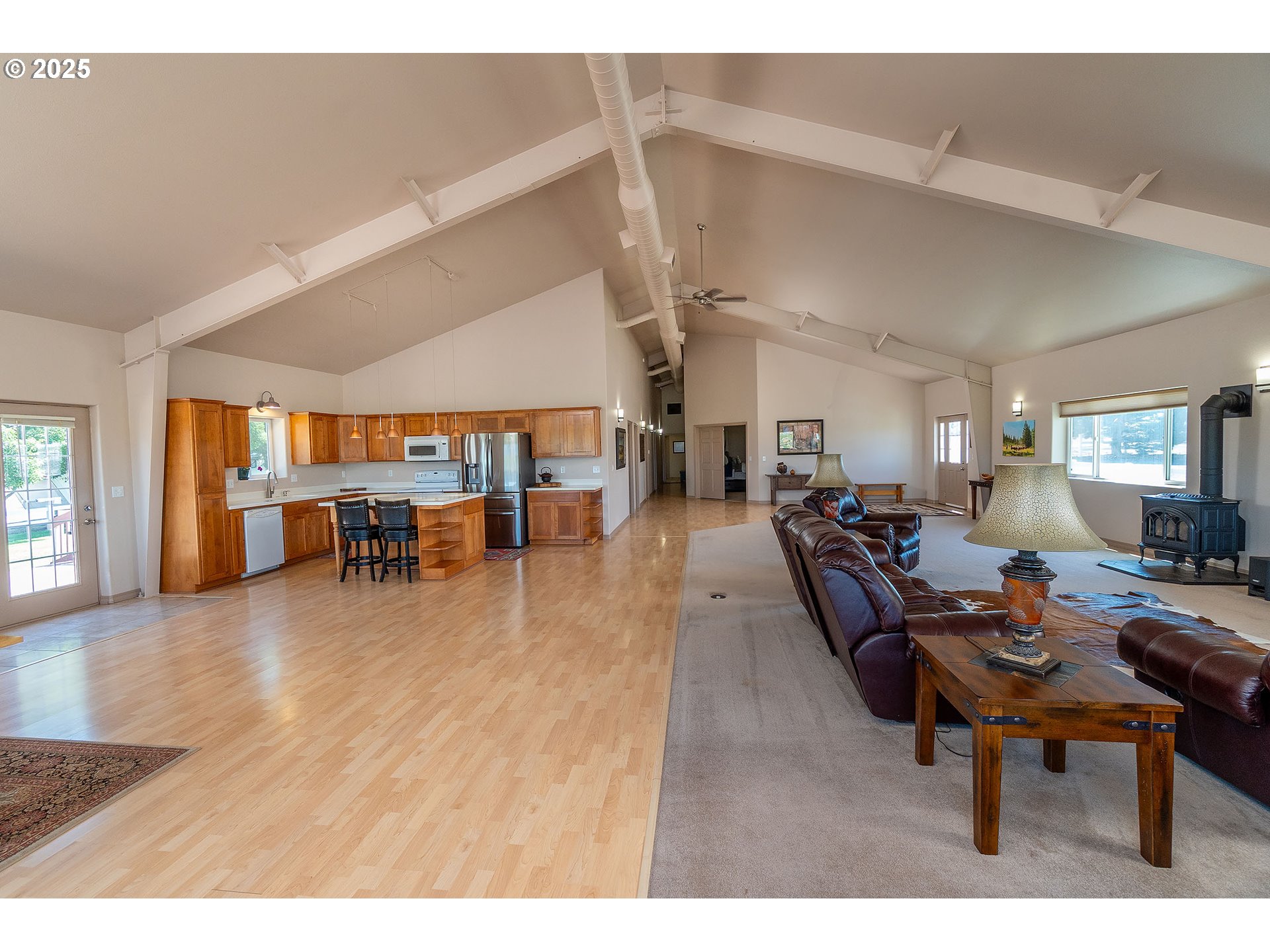12444 Southwest Green Drive Culver, OR 97734 - Photo 24 of 34 a living room with lots of furniture wooden floor and windows