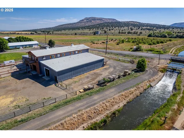a view of a ocean with a table and chairs