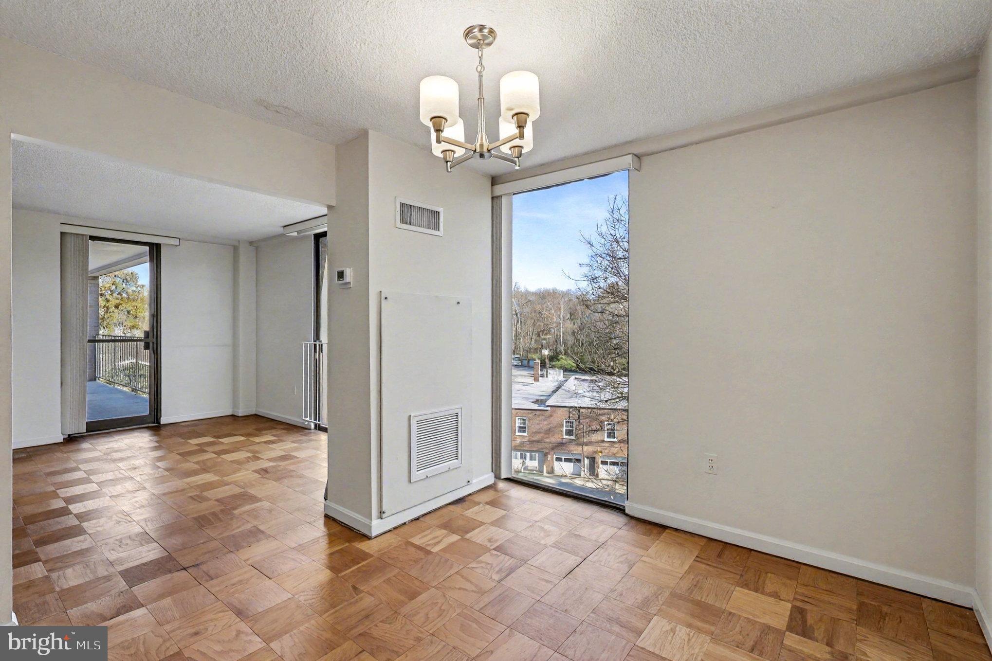 2100 Washington Avenue, Unit 6B Silver Spring, MD 20910 - Photo 11 of 33 wooden floor in an empty room with a window