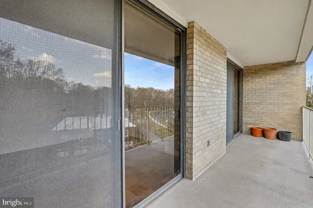a view of a glass door with a balcony