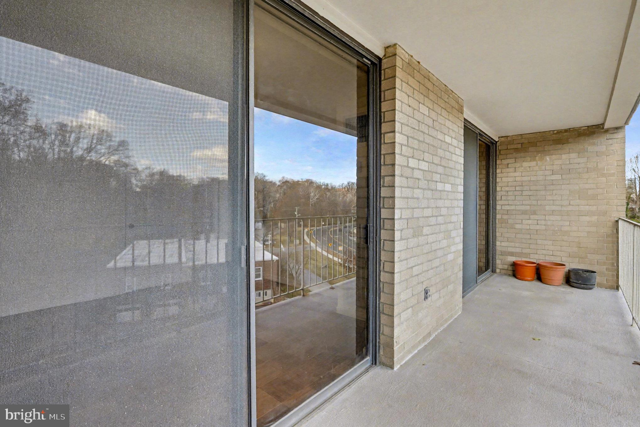 2100 Washington Avenue, Unit 6B Silver Spring, MD 20910 - Photo 14 of 33 a view of a glass door with a balcony