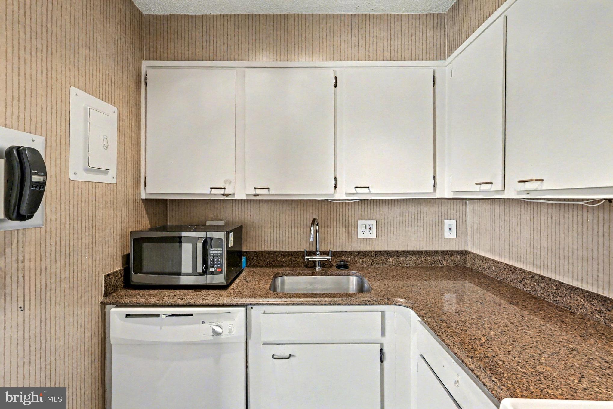 2100 Washington Avenue, Unit 6B Silver Spring, MD 20910 - Photo 16 of 33 a kitchen with a sink and cabinets