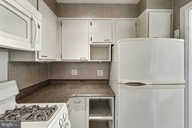 a close view of a stove top oven sitting inside of a kitchen
