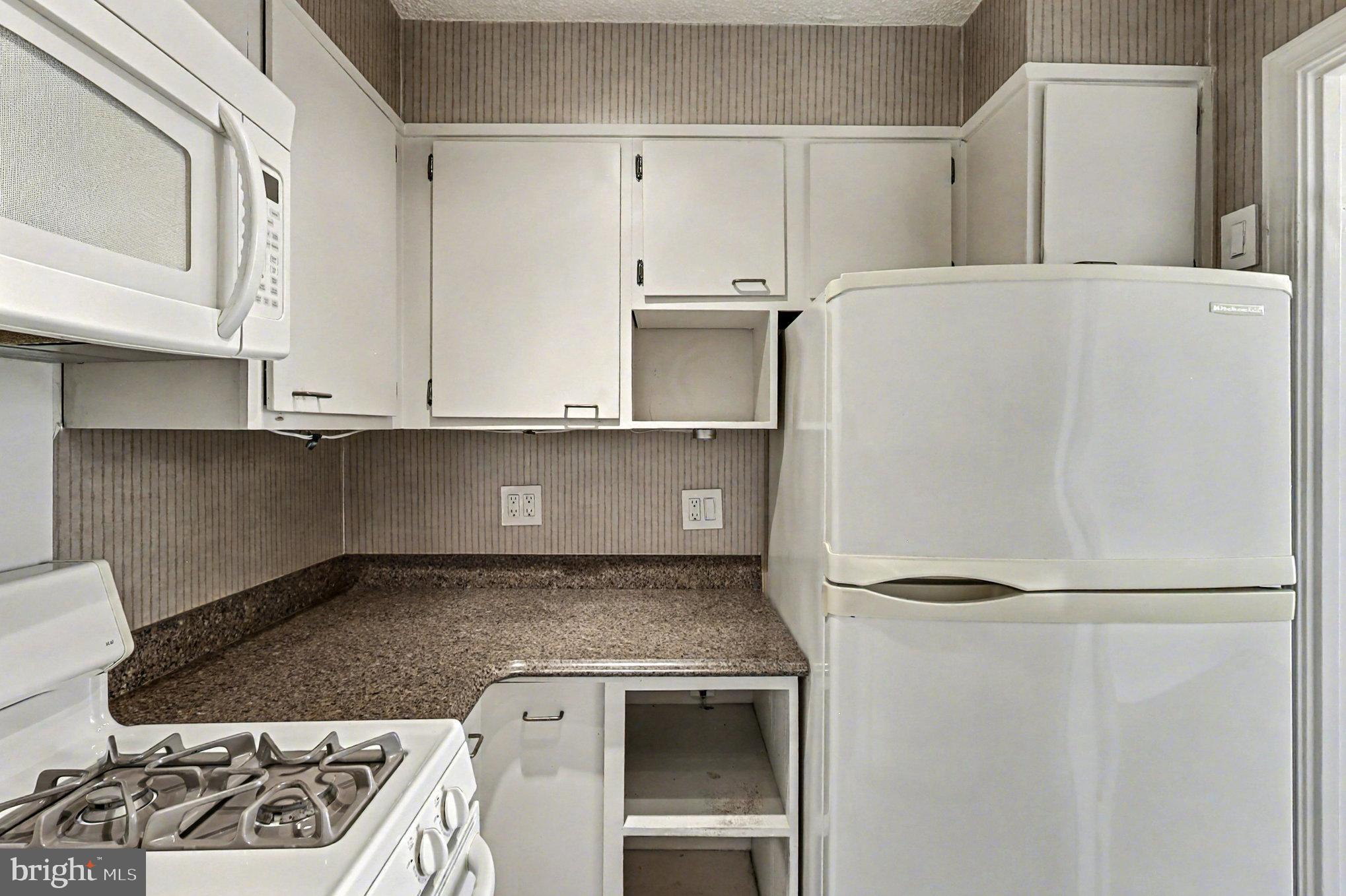2100 Washington Avenue, Unit 6B Silver Spring, MD 20910 - Photo 17 of 33 a close view of a stove top oven sitting inside of a kitchen