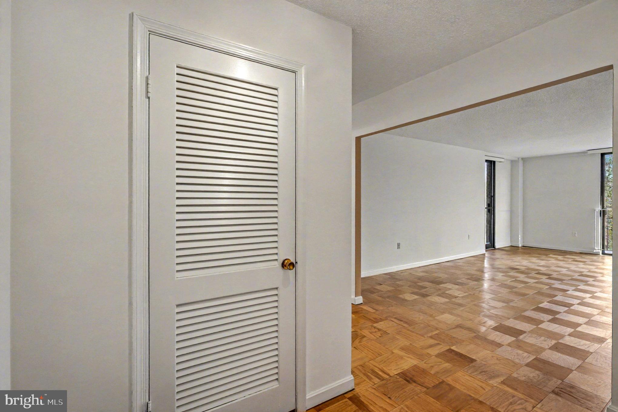 2100 Washington Avenue, Unit 6B Silver Spring, MD 20910 - Photo 7 of 33 a view of an empty room with wooden floor