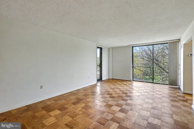 a view of an empty room with a window