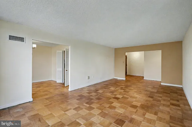 a view of an empty room and window