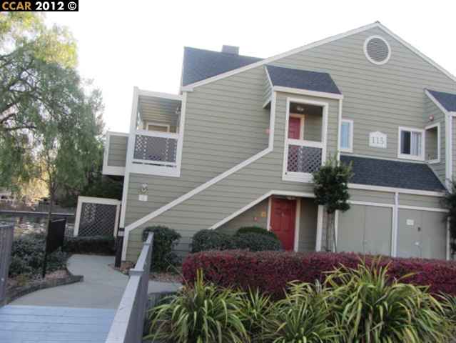 115 Reflections Drive, Unit 28 San Ramon, CA 94583 - Photo 1 of 1 a front view of house with yard and mountain view in back