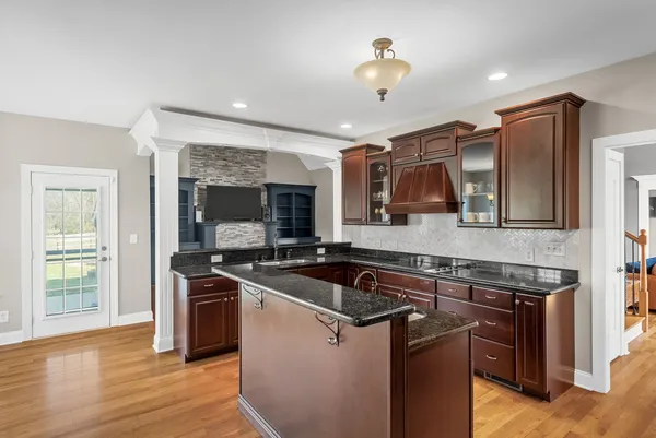an empty room with a ceiling fan and carpet