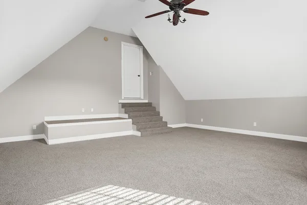 a front view of a house with a yard table and chairs