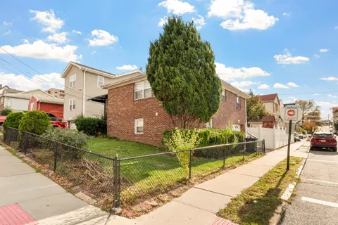 a view of a street with a building in the background