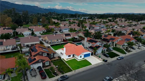 an aerial view of a house with a garden