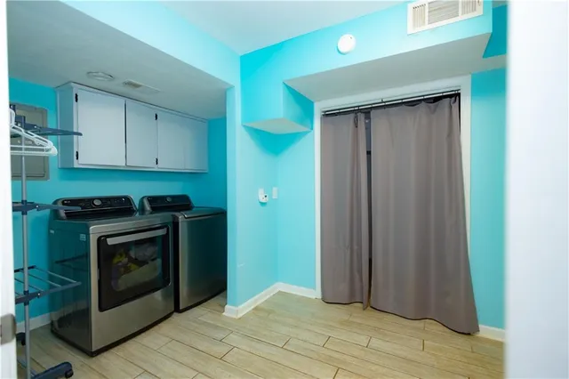 a view of a kitchen with washer and dryer
