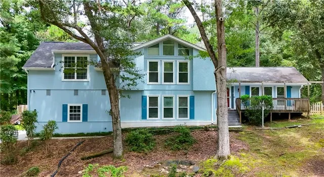 a front view of a house with garden
