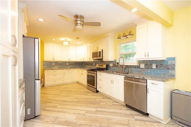 a view of a kitchen with a sink