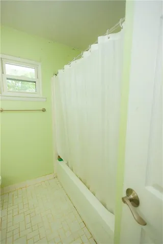 a bathroom with a sink mirror and toilet