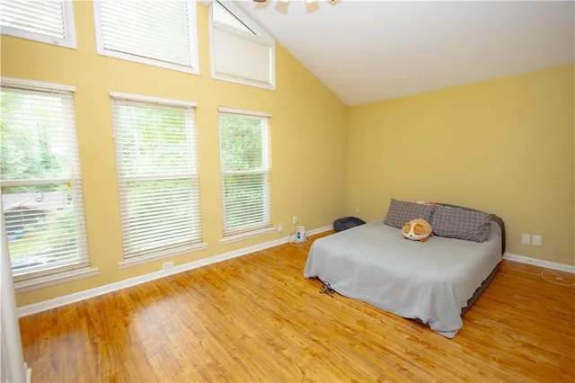 an aerial view of a house with swimming pool and garden