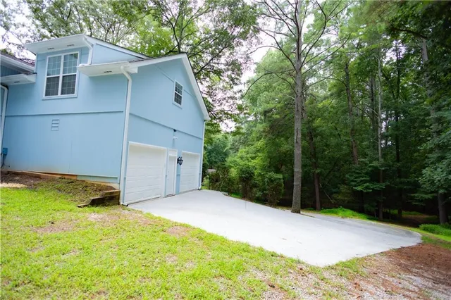 a backyard of a house with lots of green space