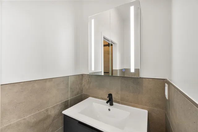 a bathroom with a sink and a window