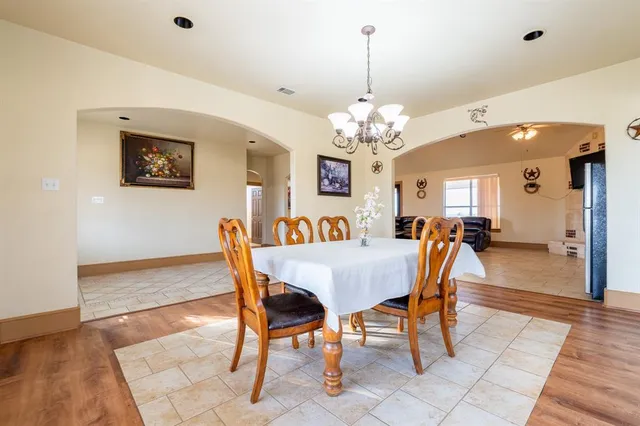 a view of kitchen and dining room with wooden floor