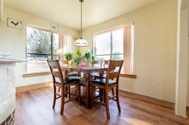 a kitchen with stainless steel appliances granite countertop a refrigerator and a stove
