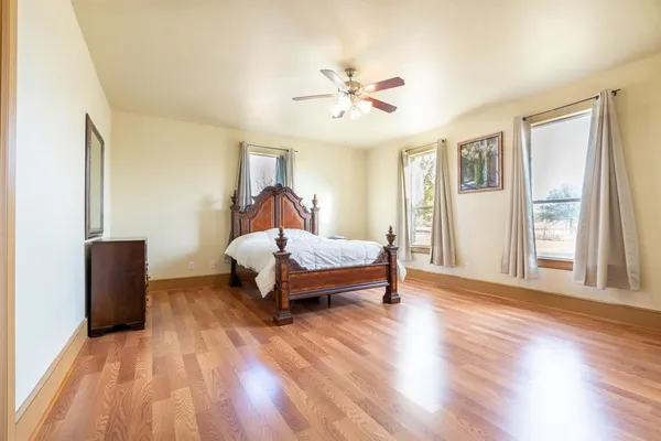a bathroom with a granite countertop sink and a bathtub