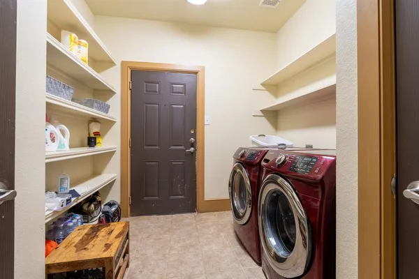 a living room with furniture a window and a ceiling fan