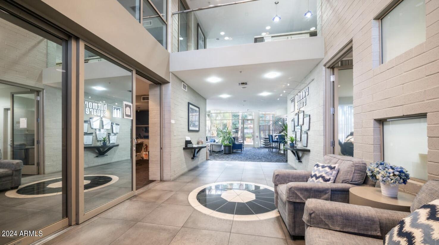 1701 East Colter Street, Unit 215 Phoenix, AZ 85016 - Photo 26 of 28 a lobby with furniture and a glass door