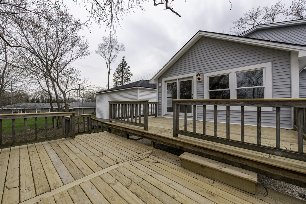 24199 West Beach Grove Road Antioch, IL 60002 - Photo 20 of 22 a view of a house with a wooden deck