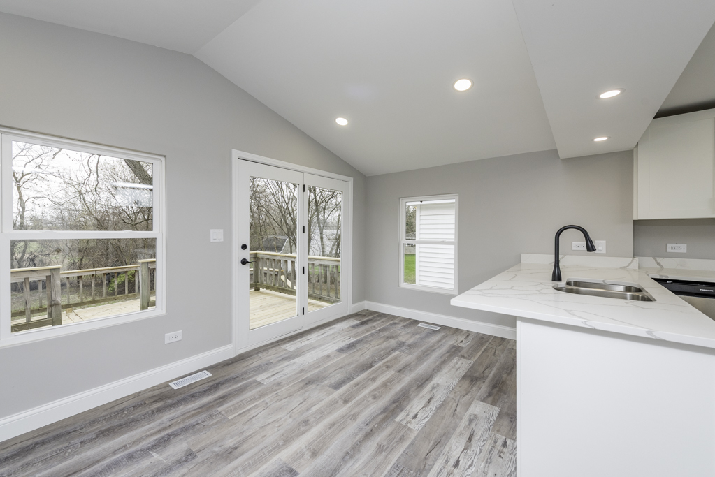 24199 West Beach Grove Road Antioch, IL 60002 - Photo 9 of 22 a spacious bathroom with a window a sink and a mirror